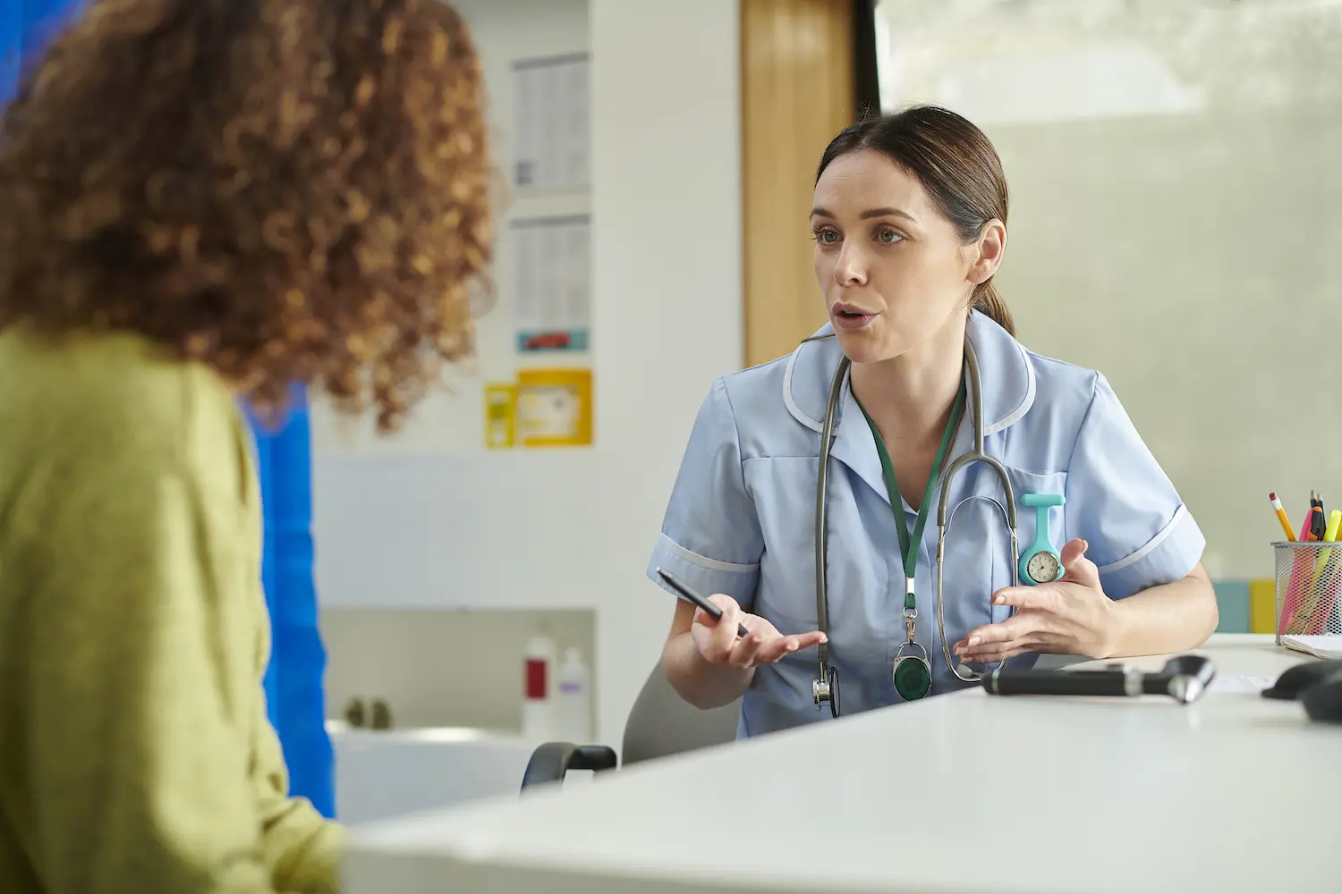 Nurse talking to patient