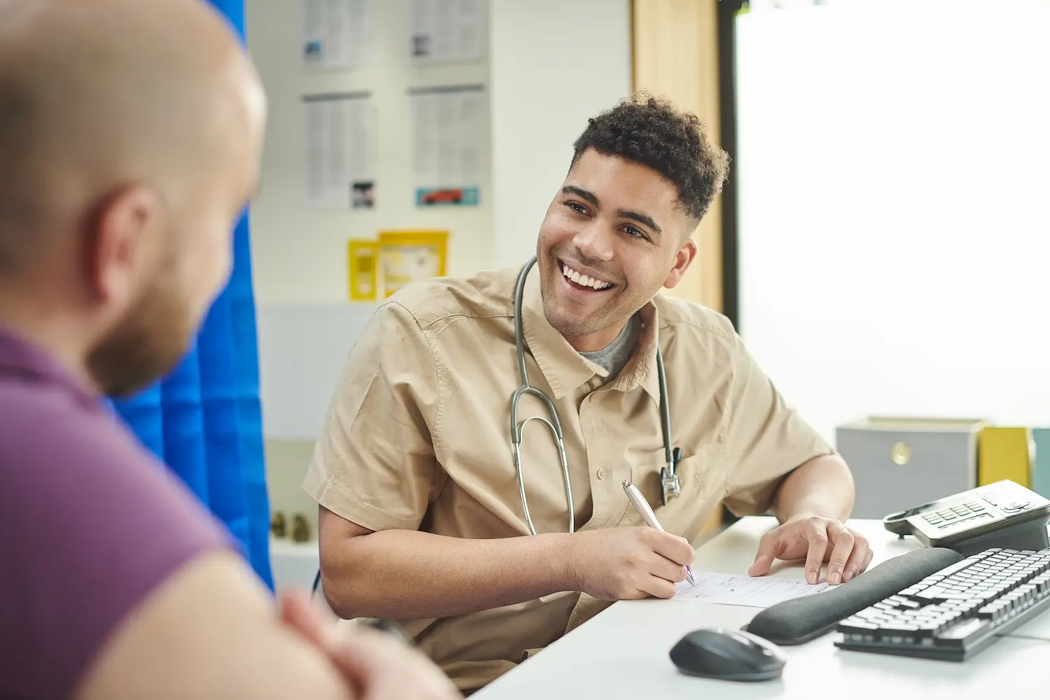 Clinician consulting with patient