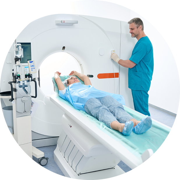 Healthcare professional and patient having CT scan