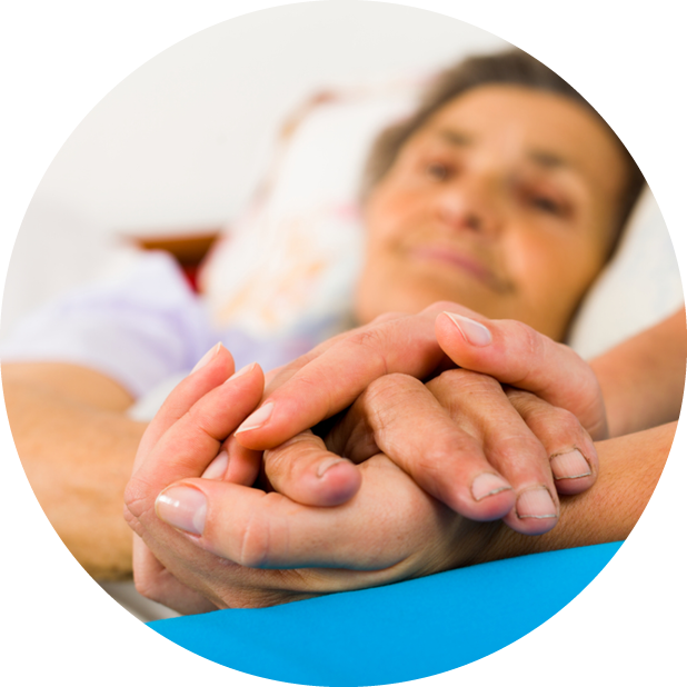 healthcare professional holding patient's hand